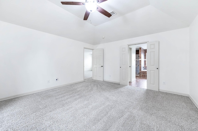 unfurnished bedroom featuring carpet floors, visible vents, baseboards, and a ceiling fan