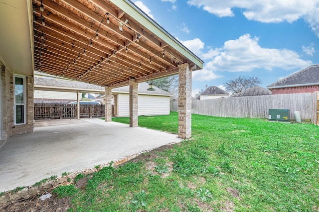 view of yard with a fenced backyard and a patio