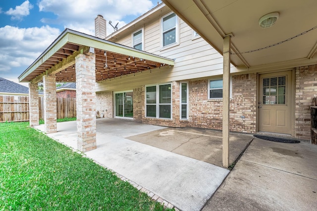 view of patio featuring fence