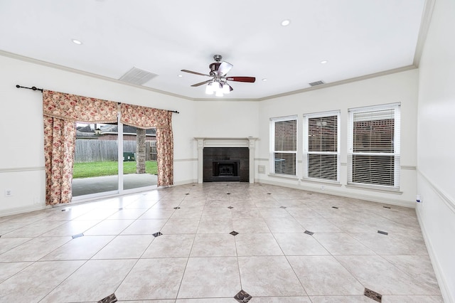 unfurnished living room with a fireplace, visible vents, ornamental molding, and tile patterned floors