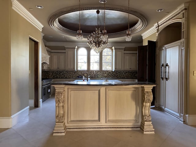 11117 Beinhorn Rd, Houston, TX 77024 - kitchen with a raised ceiling, a chandelier, dark countertops, backsplash, and crown molding