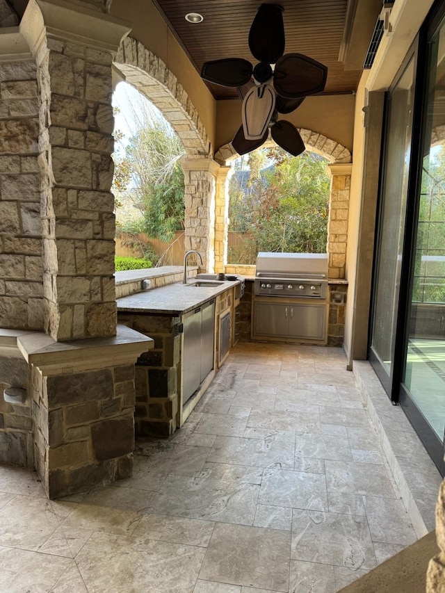 11117 Beinhorn Rd, Houston, TX 77024 - view of patio with area for grilling, an outdoor kitchen, a sink, and ceiling fan