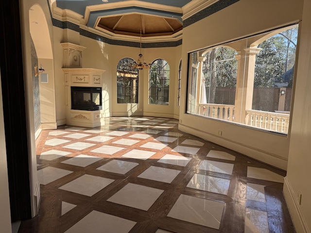 11117 Beinhorn Rd, Houston, TX 77024 - unfurnished sunroom featuring a chandelier and coffered ceiling