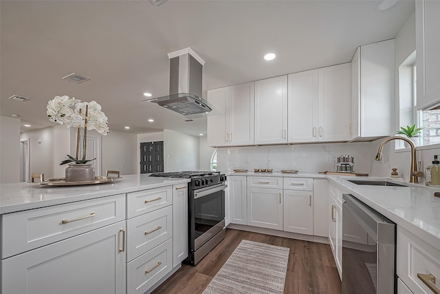 kitchen featuring visible vents, dishwasher, island exhaust hood, a sink, and gas stove