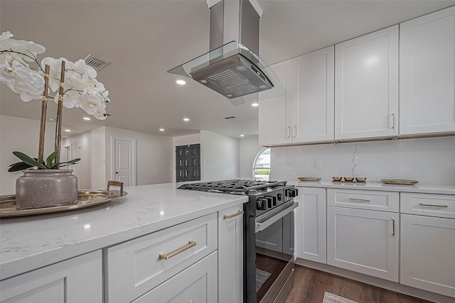 kitchen featuring recessed lighting, dark wood-type flooring, white cabinetry, gas stove, and island exhaust hood