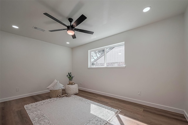 interior space featuring dark wood-type flooring, recessed lighting, visible vents, and baseboards