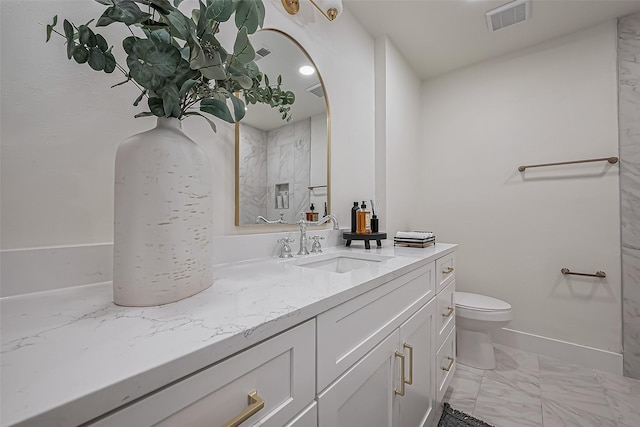 full bath with marble finish floor, visible vents, toilet, vanity, and baseboards