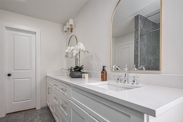 bathroom featuring double vanity and a sink