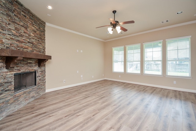 unfurnished living room with crown molding, a fireplace, and wood finished floors