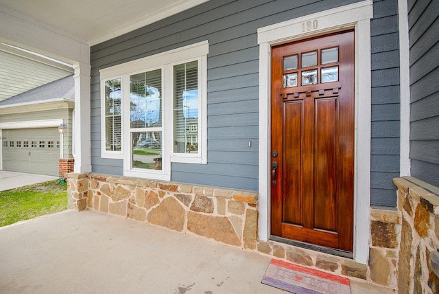 doorway to property with covered porch