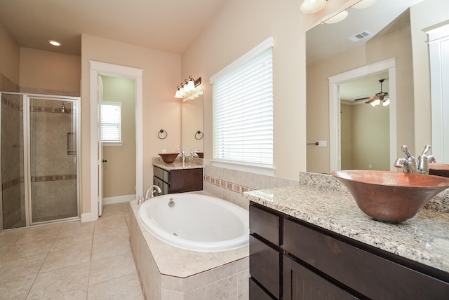 full bathroom with a stall shower, visible vents, a sink, and a garden tub