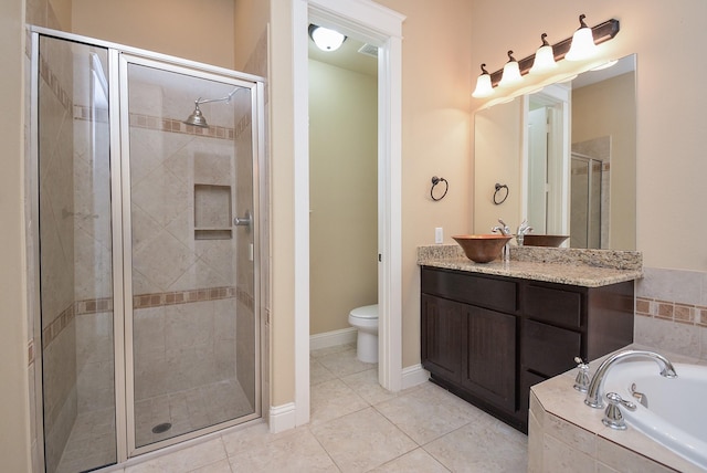 full bathroom with toilet, a stall shower, vanity, a bath, and tile patterned floors