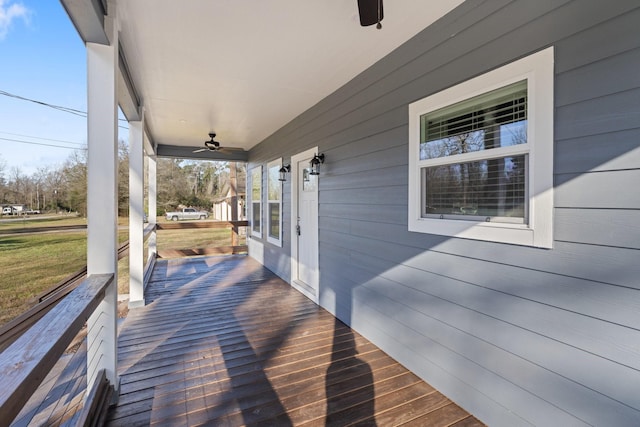 deck with covered porch and ceiling fan