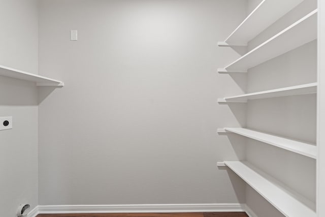 washroom with laundry area, electric dryer hookup, and baseboards