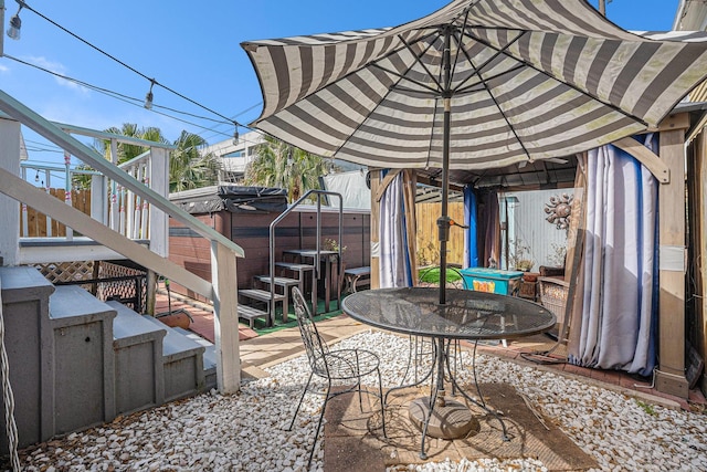 view of patio with stairway and outdoor dining space