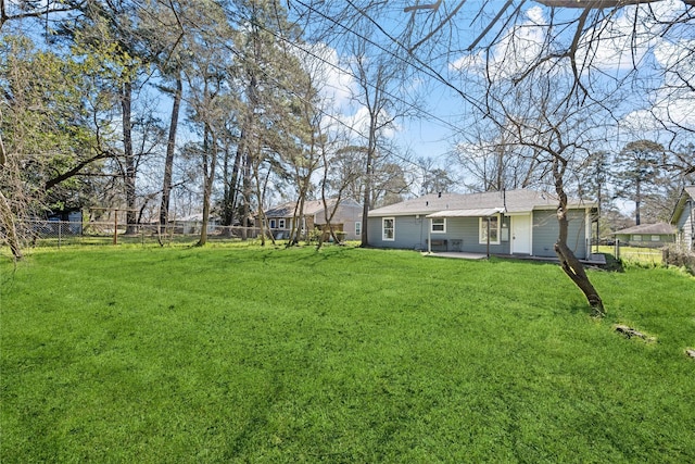 view of yard featuring a patio area and fence