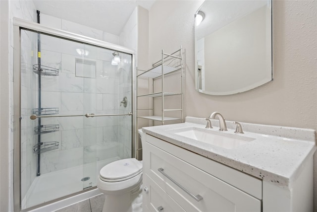 full bath with toilet, a stall shower, and vanity