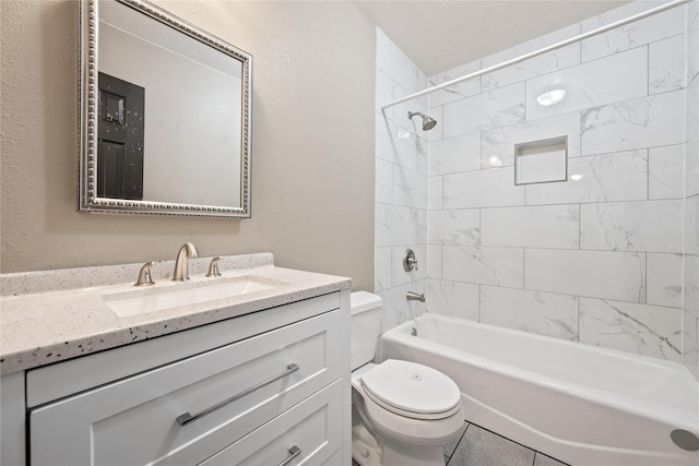 bathroom featuring shower / bathtub combination, toilet, vanity, and a textured wall