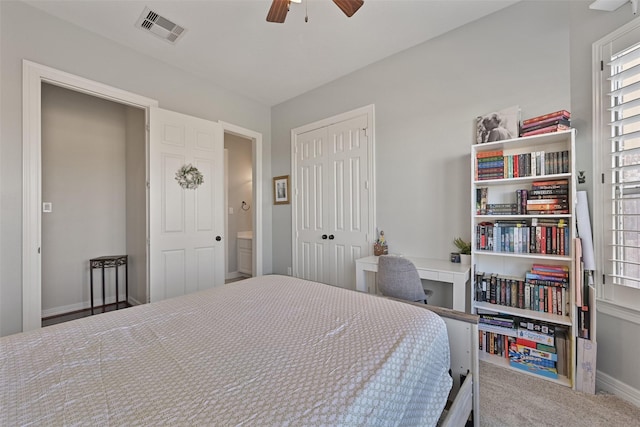 bedroom featuring baseboards, visible vents, ceiling fan, carpet, and a closet