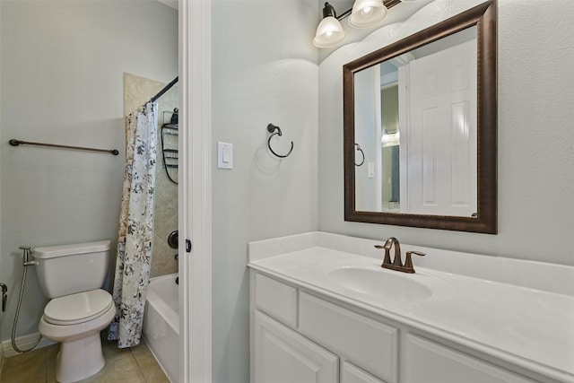 bathroom with shower / bath combination with curtain, vanity, toilet, and tile patterned floors