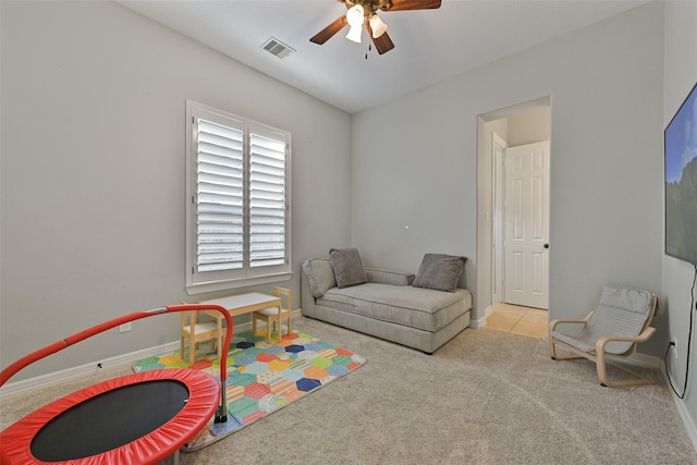 playroom with a ceiling fan, carpet, visible vents, and baseboards