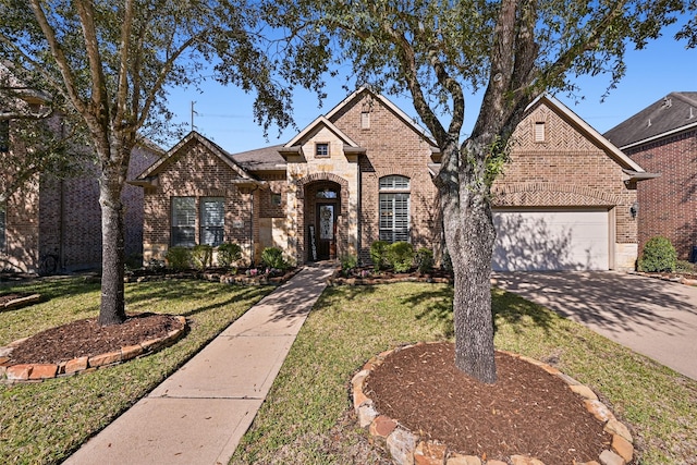 french country style house with a garage, brick siding, driveway, stone siding, and a front lawn