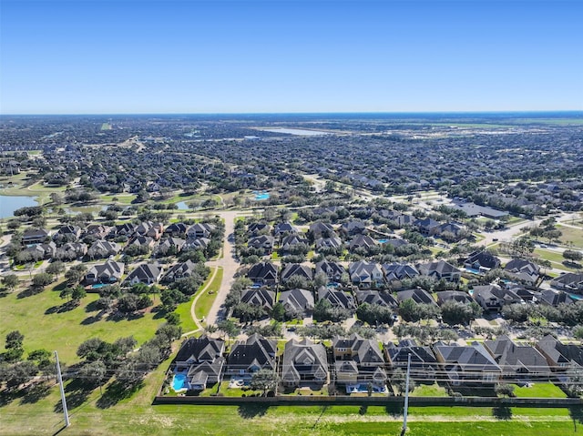 bird's eye view featuring a residential view and a water view