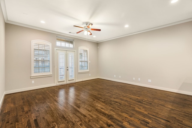 unfurnished room with dark wood-style floors, french doors, crown molding, and baseboards