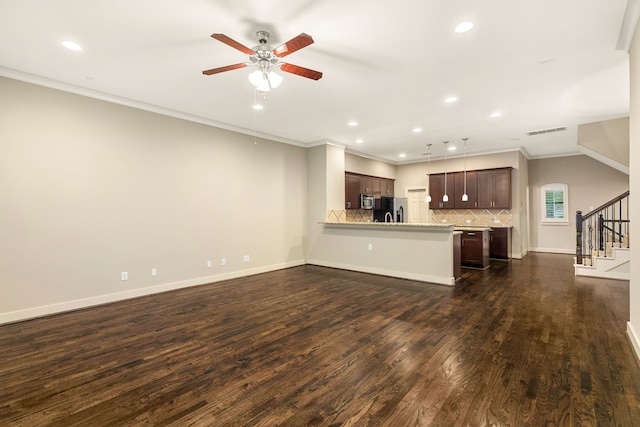 unfurnished living room with dark wood-type flooring, visible vents, baseboards, and stairs