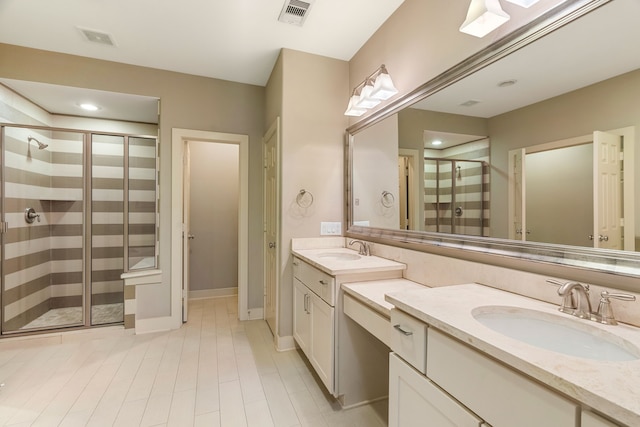 full bathroom with a shower stall, visible vents, and a sink