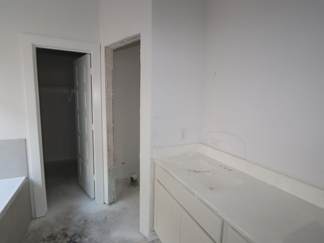 8622 Pier Cove Dr, Cypress, TX 77433 - bathroom with unfinished concrete floors and vanity