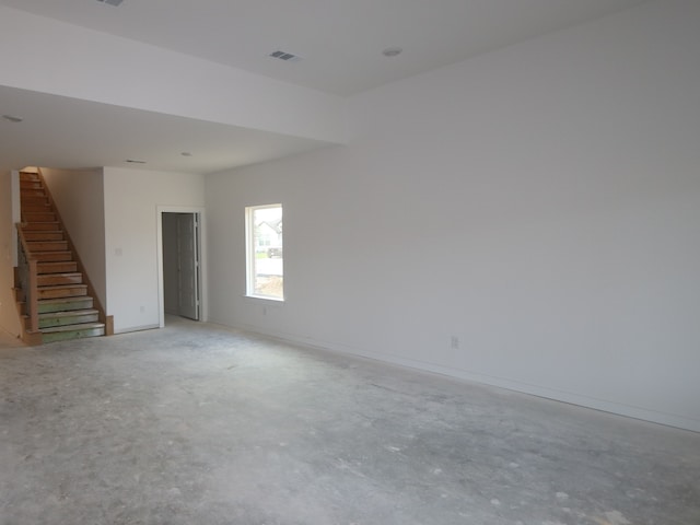 8622 Pier Cove Dr, Cypress, TX 77433 - spare room with stairs and unfinished concrete flooring