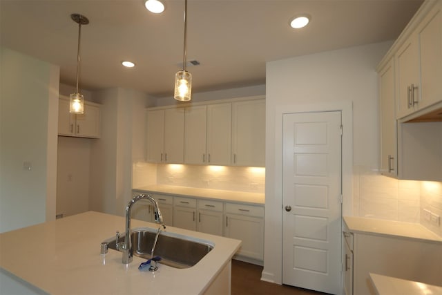 8622 Pier Cove Dr, Cypress, TX 77433 - kitchen featuring recessed lighting, backsplash, white cabinets, light countertops, and pendant lighting