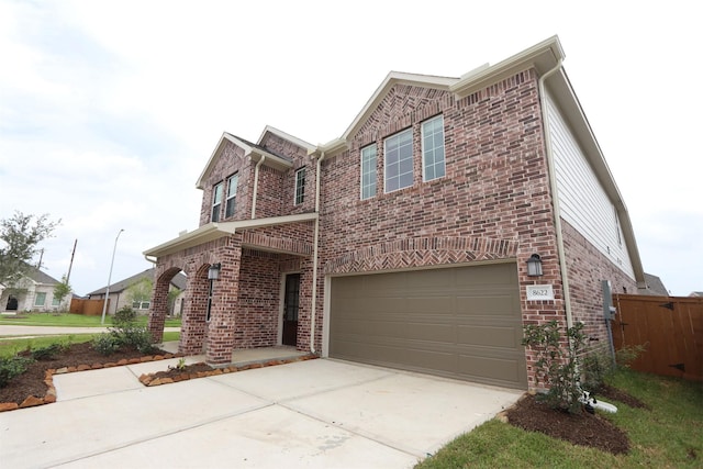 8622 Pier Cove Dr, Cypress, TX 77433 - view of front of house featuring brick siding, a garage, and driveway