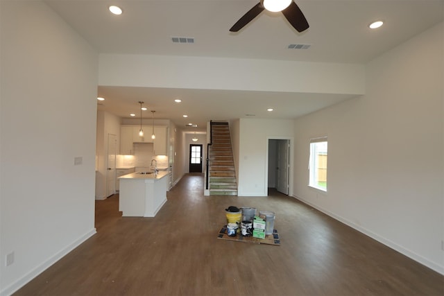 8622 Pier Cove Dr, Cypress, TX 77433 - unfurnished living room featuring dark wood-style floors, a ceiling fan, recessed lighting, and stairway