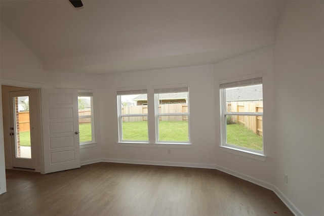 8622 Pier Cove Dr, Cypress, TX 77433 - empty room with wood finished floors, plenty of natural light, and vaulted ceiling
