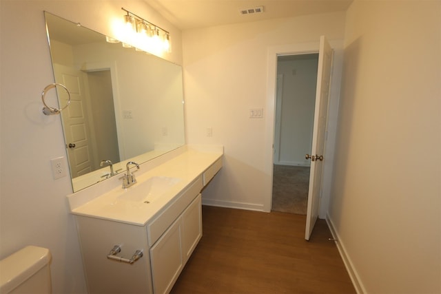 8622 Pier Cove Dr, Cypress, TX 77433 - half bathroom featuring wood finished floors and vanity