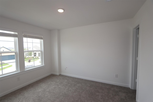 8622 Pier Cove Dr, Cypress, TX 77433 - carpeted empty room with baseboards