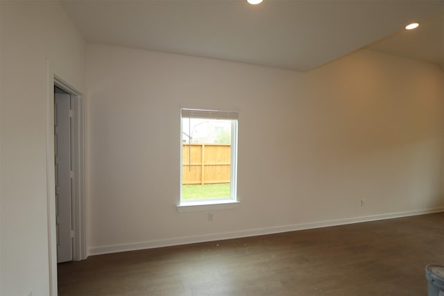 8622 Pier Cove Dr, Cypress, TX 77433 - empty room with recessed lighting, dark wood finished floors, and lofted ceiling