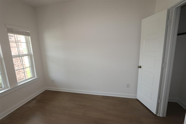8622 Pier Cove Dr, Cypress, TX 77433 - spare room with dark wood-type flooring and baseboards