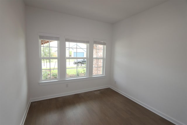 8622 Pier Cove Dr, Cypress, TX 77433 - empty room with dark wood-type flooring and baseboards