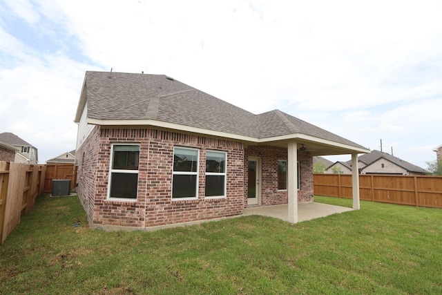 8622 Pier Cove Dr, Cypress, TX 77433 - rear view of property featuring a shingled roof, brick siding, a fenced backyard, and a patio area