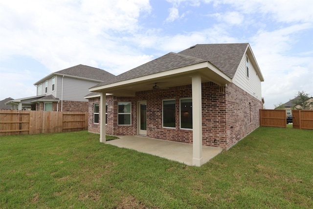 8622 Pier Cove Dr, Cypress, TX 77433 - back of house with brick siding, a ceiling fan, a shingled roof, a patio, and a fenced backyard