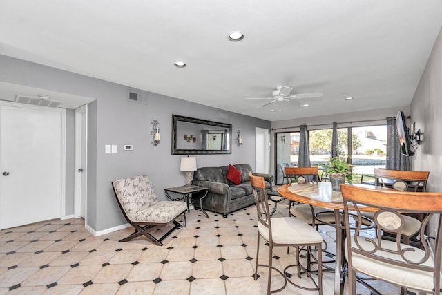 living area featuring baseboards, visible vents, a ceiling fan, and recessed lighting