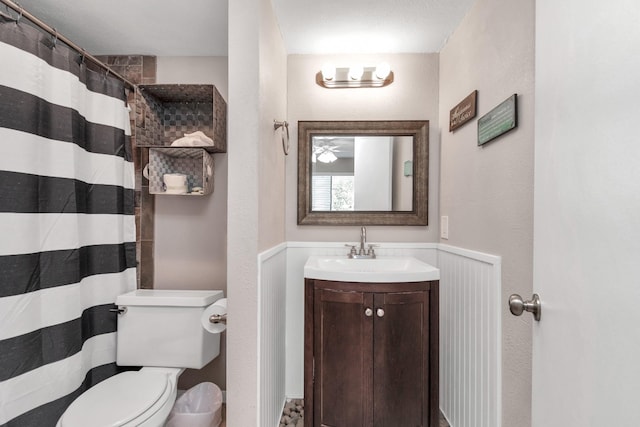 bathroom with vanity, toilet, and a shower with curtain