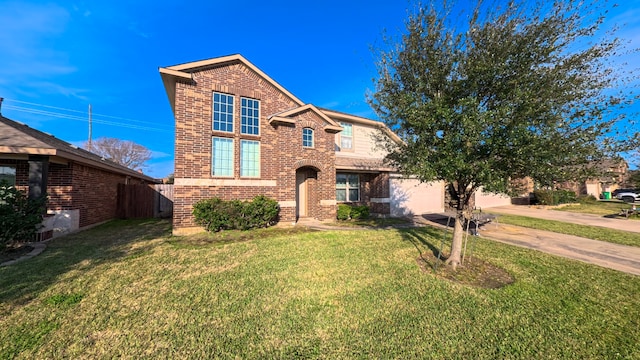 traditional-style house featuring a front yard, concrete driveway, and brick siding