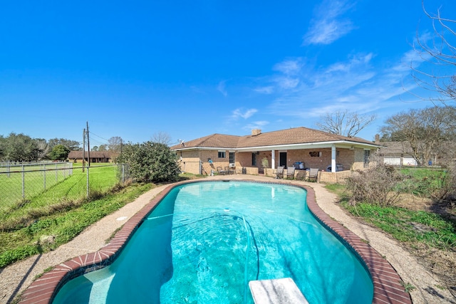 view of swimming pool featuring a patio area, a fenced backyard, and a fenced in pool