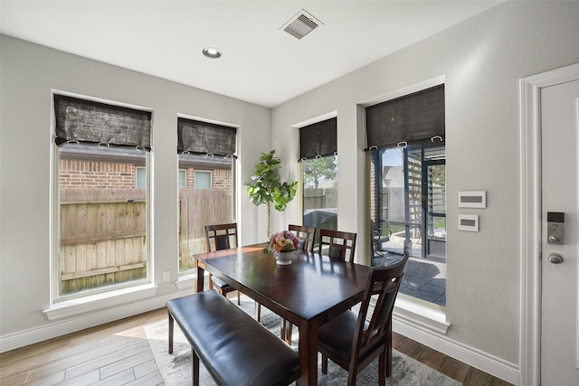 dining area featuring recessed lighting, wood finished floors, visible vents, and baseboards