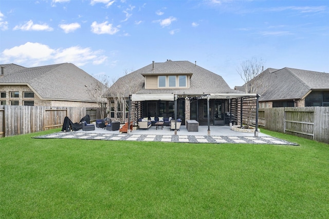 back of property with an outdoor hangout area, a lawn, a patio area, and a fenced backyard