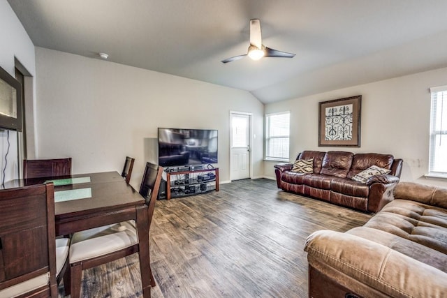 living room with a ceiling fan, lofted ceiling, and wood finished floors